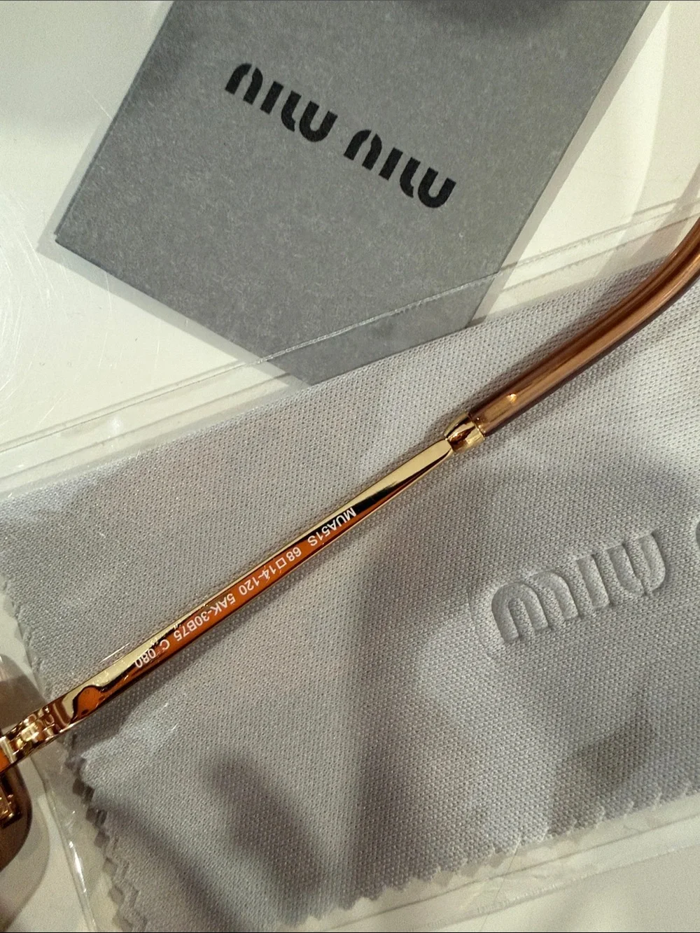 Miu Miu Brown Rimless Sunglasses with Gold Bridge